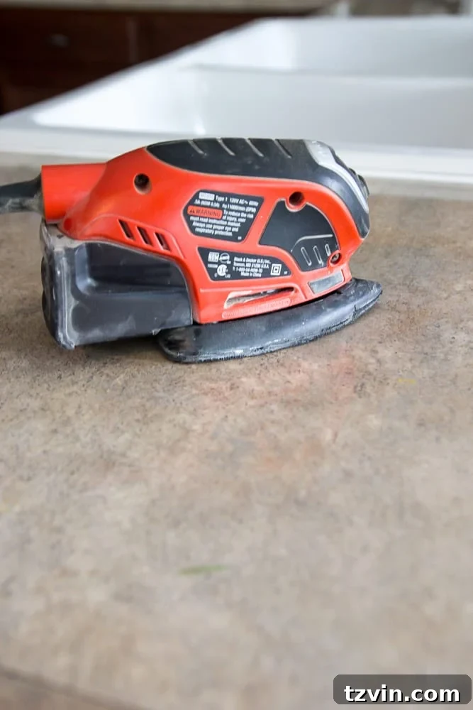 Sanding existing laminate countertops for concrete adhesion