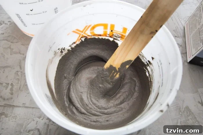 Mixing Ardex feather finish concrete in a bucket
