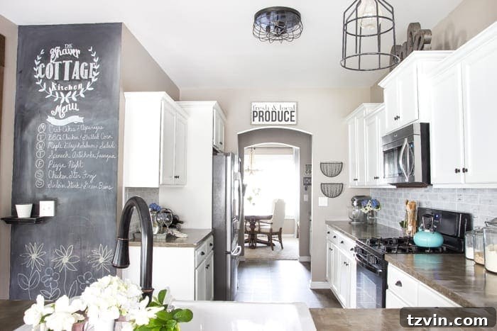 Elevate Your Kitchen: Pro Strategies for Cabinet Painting 16 Another perspective of the bright kitchen featuring painted white cabinets, with a view towards the dining area and an old black range waiting to be replaced.