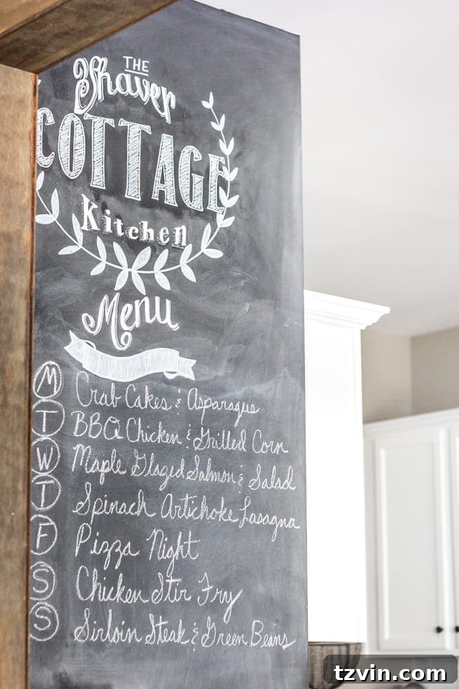 Elevate Your Kitchen: Pro Strategies for Cabinet Painting 21 A functional chalkboard wall in the newly painted kitchen, used for meal planning and creative drawings, adding a personal touch to the renovated space.