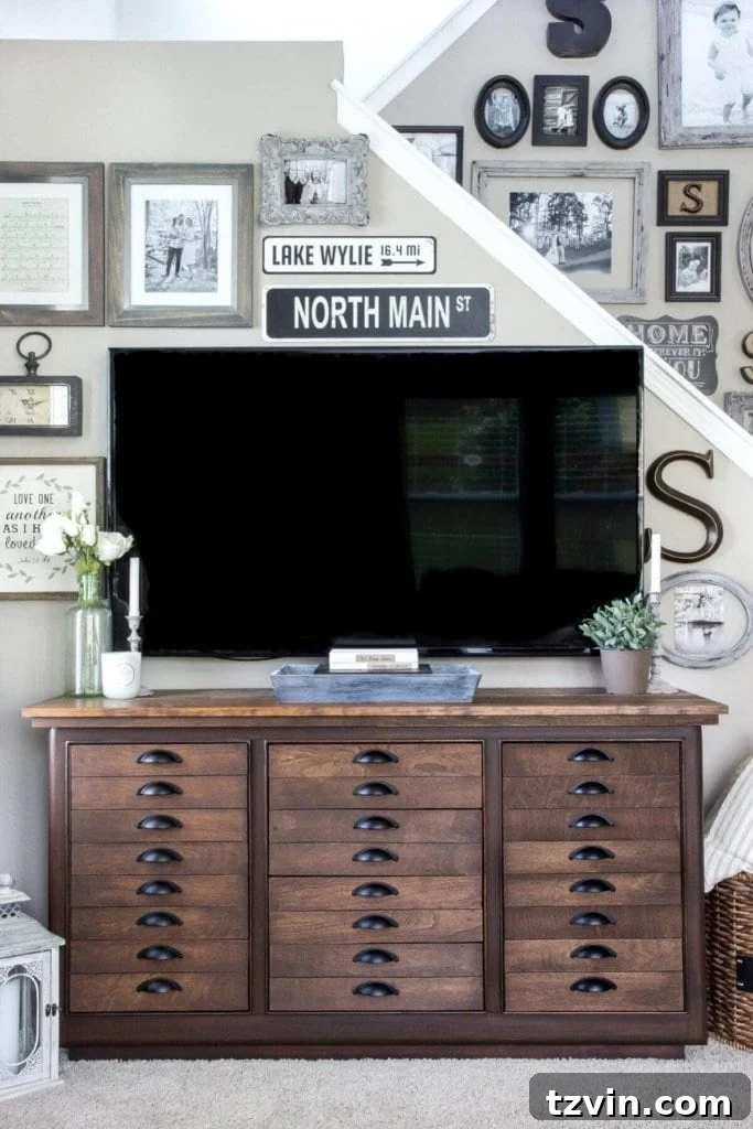 Elevate Your TV Area Style 9 Gallery wall with a large TV, creating an eclectic and personalized look