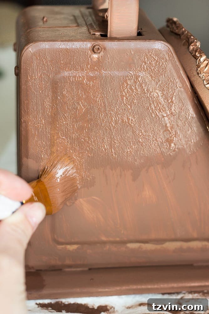 Rustic Chic Vintage Scale Makeover 7 Close-up of the brush pouncing technique used with bark brown paint to add texture for the faux rust finish on a metal scale.