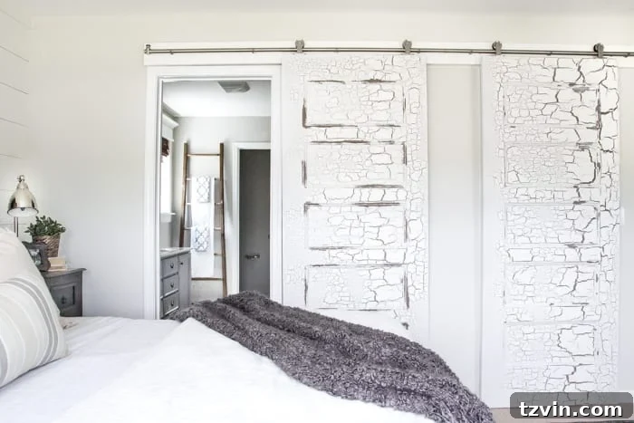 DIY Sliding Barn Door Installation 13 Close-up of the stainless steel barn door hardware, highlighting its sleek design.
