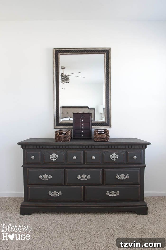 Get the Look: Our Rustic Modern Master Bedroom Transformation 13 Before: A simple, uninspired dresser against a plain wall in the master bedroom.
