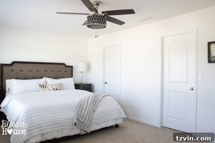 Get the Look: Our Rustic Modern Master Bedroom Transformation 6 Before: Traditional hinged doors in the master bedroom, creating functional challenges and limited space.
