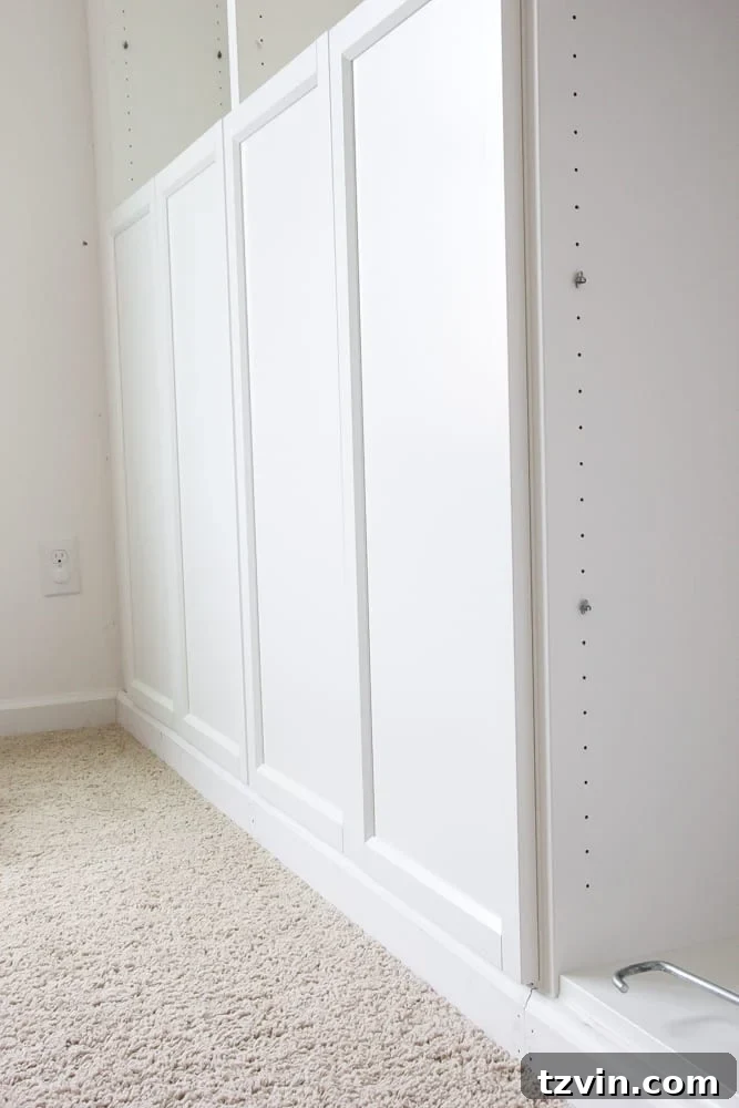 Custom base cabinets created using Oxberg doors on IKEA Billy bookcases, showing the finished integrated look.