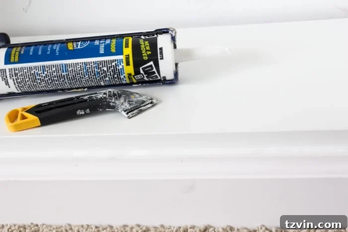 Close-up of caulked lines on IKEA bookcase built-ins, demonstrating how caulk creates a smooth, professional finish.
