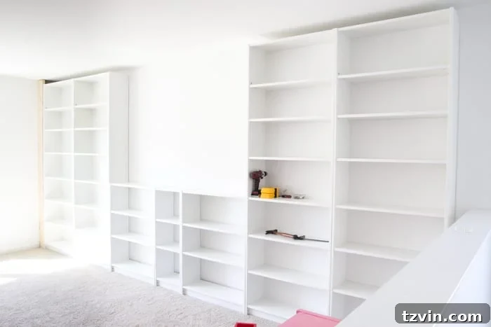 Close-up view of DIY built-ins using IKEA Billy bookcases, highlighting the seamless integration with the wall.