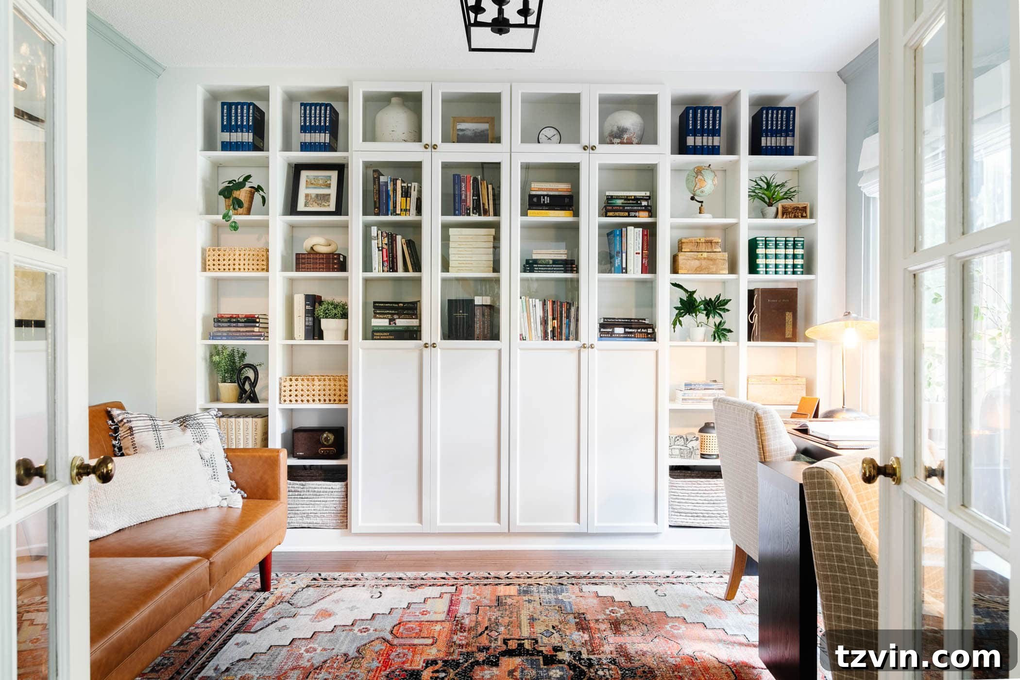 Stylish home office featuring IKEA built-in shelves with glass doors, providing sophisticated storage and display.