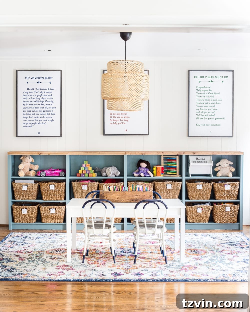 IKEA Billy bookshelves integrated into a half-height built-in unit in a bright playroom.