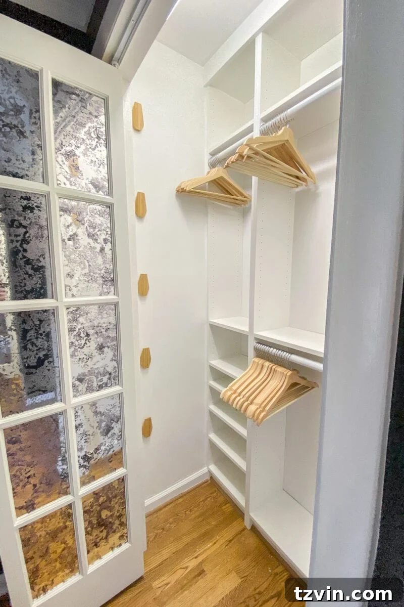 Organized IKEA built-in closet system created using Billy bookcases, maximizing storage efficiency.