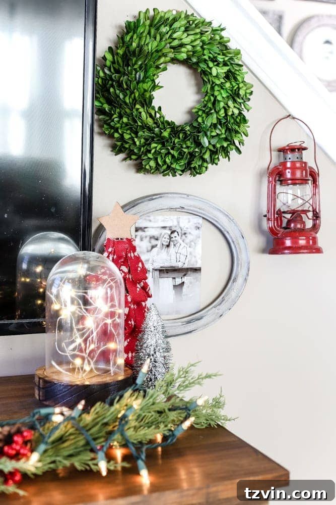 Detailed view of a farmhouse Christmas gallery wall featuring varied holiday decorations and signs.