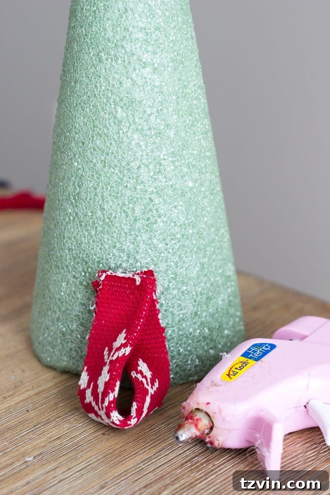 Charming Nordic Knit Mini Christmas Trees 8 DIY Nordic Sweater Mini Christmas Trees | blesserhouse.com - How to make Nordic sweater mini Christmas trees using just florist foam, ribbon, and hot glue for cute decor accents on tabletops and mantels.
