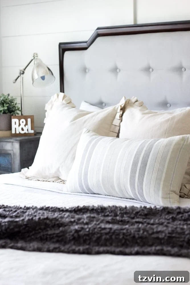 Your Blueprint for a Lightning-Fast Home Sale 12 A neatly made master bed with inviting pillows, creating a serene bedroom atmosphere.