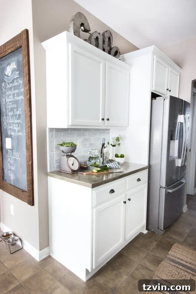 Your Blueprint for a Lightning-Fast Home Sale 10 A clean, unadorned refrigerator in a modern farmhouse kitchen.