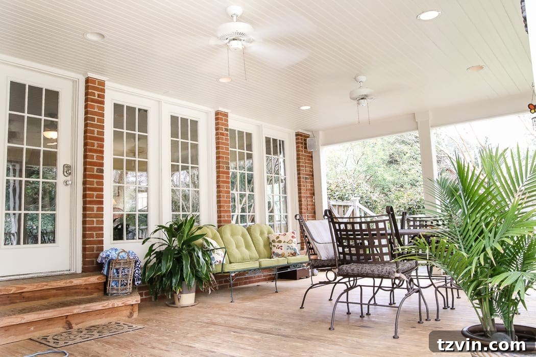 Unveiling Our New Home 9 The inviting covered back porch of the brick Colonial house, perfect for outdoor relaxation.