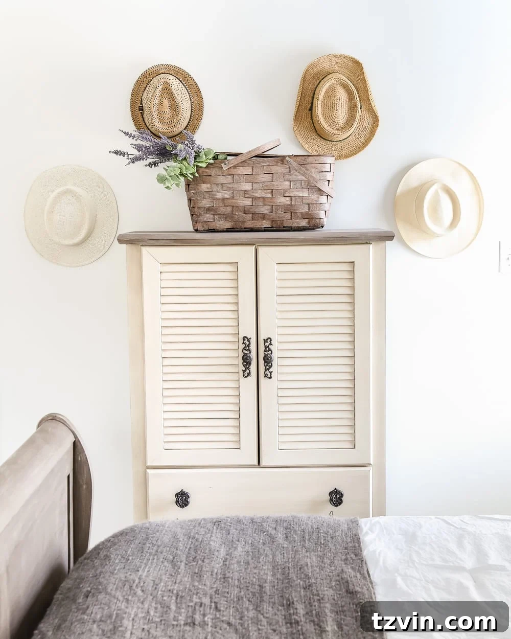 Blue cottage style guest bedroom with repurposed armoire