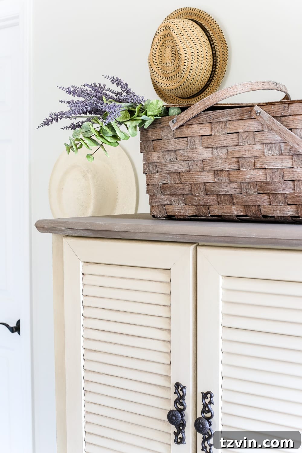 Guest bedroom with vintage hats displayed and cozy decor