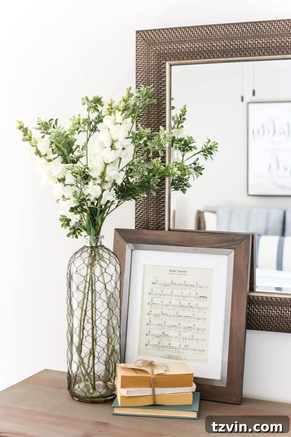 Guest bedroom details with thrifted decor and plants