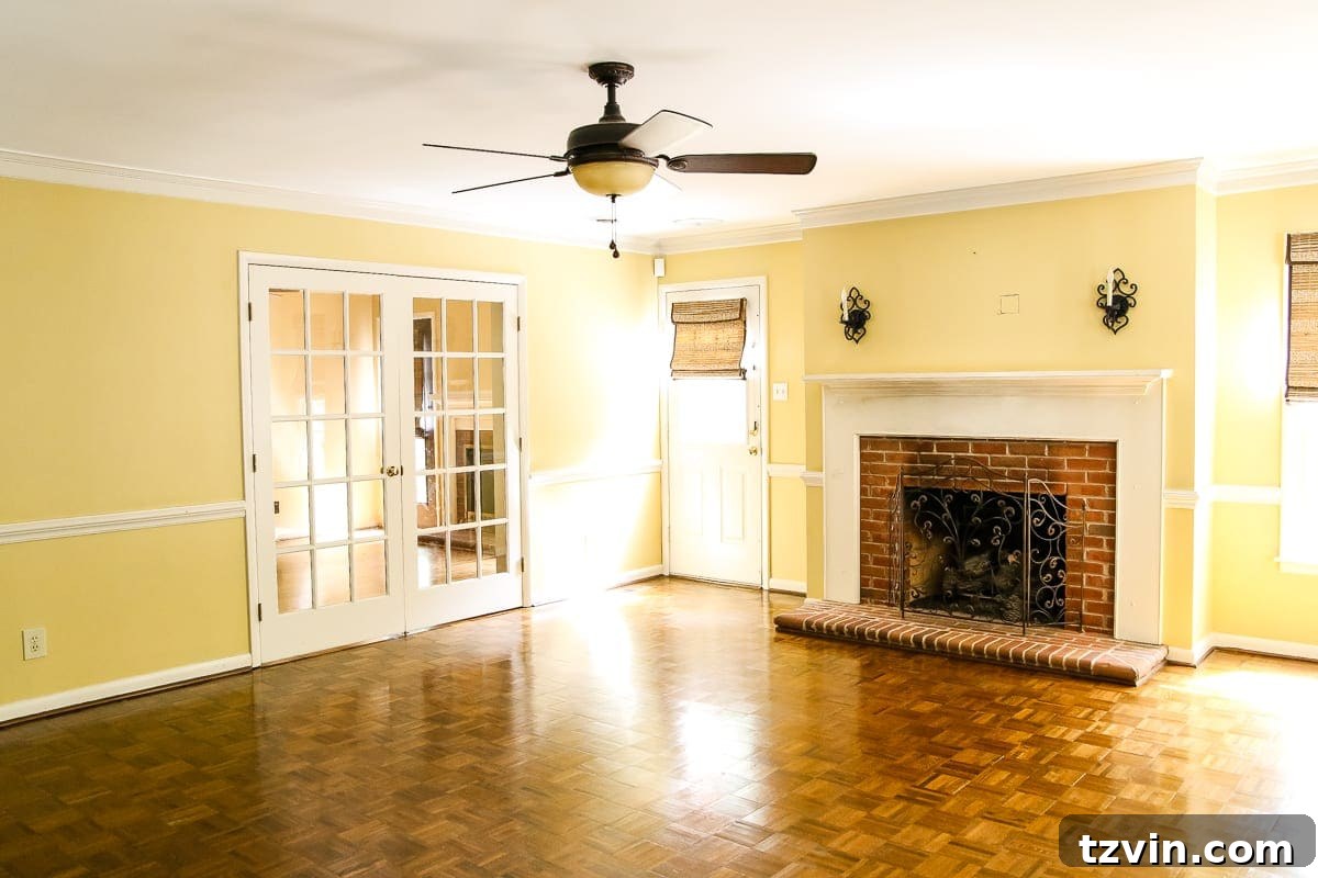 New House Interior Blank Slate Tour 14 Living Room Before Redesign - French Doors and Fireplace