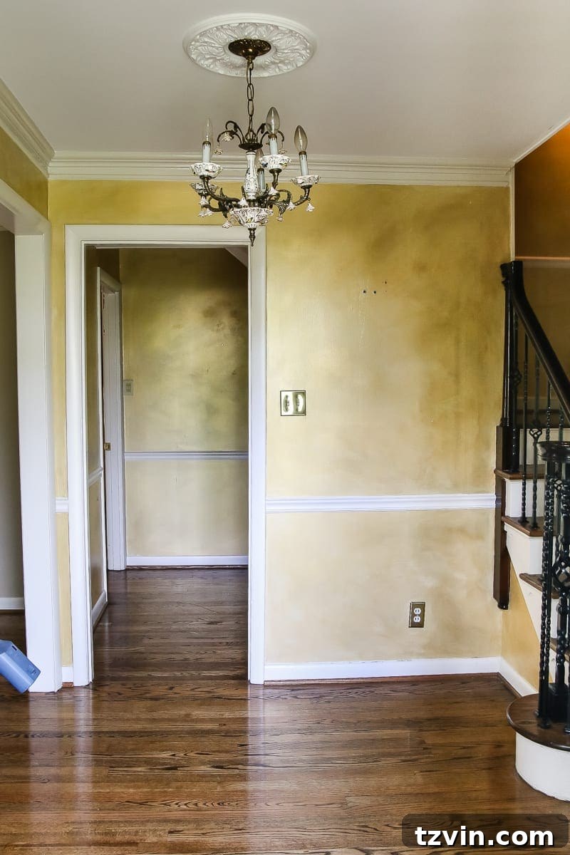 New House Interior Blank Slate Tour 5 Foyer with Staircase and Chandelier Before Home Redesign