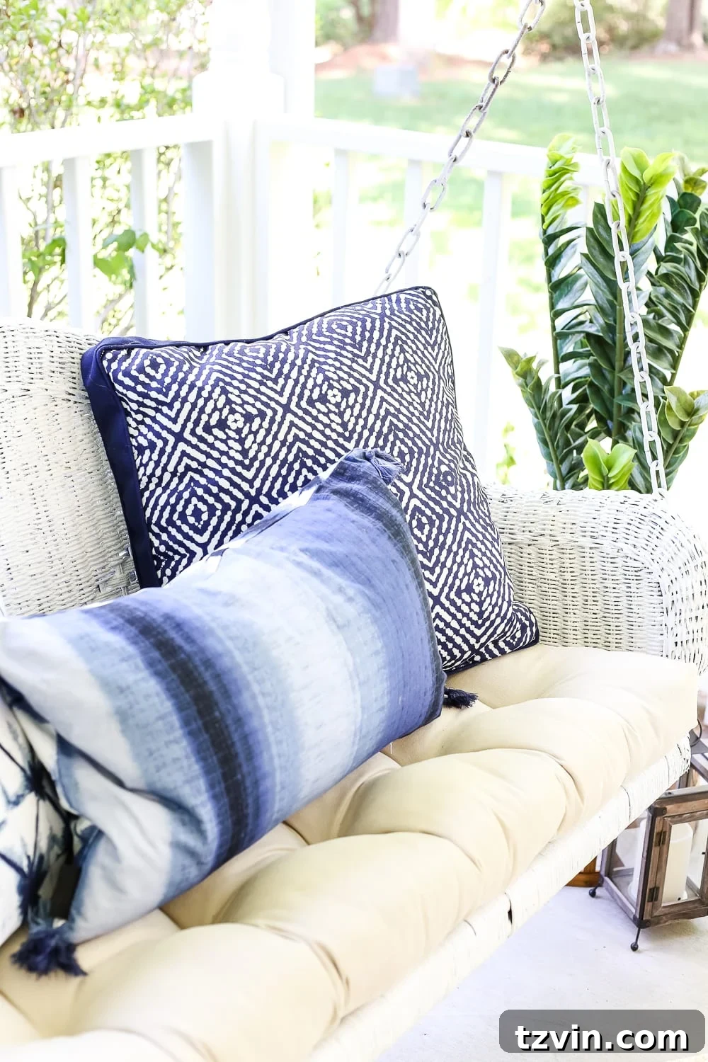 Unlock Your Outdoor Space's Full Potential 11 Decorative outdoor lanterns placed on a garden stool, adding ambiance to a charming porch setting.