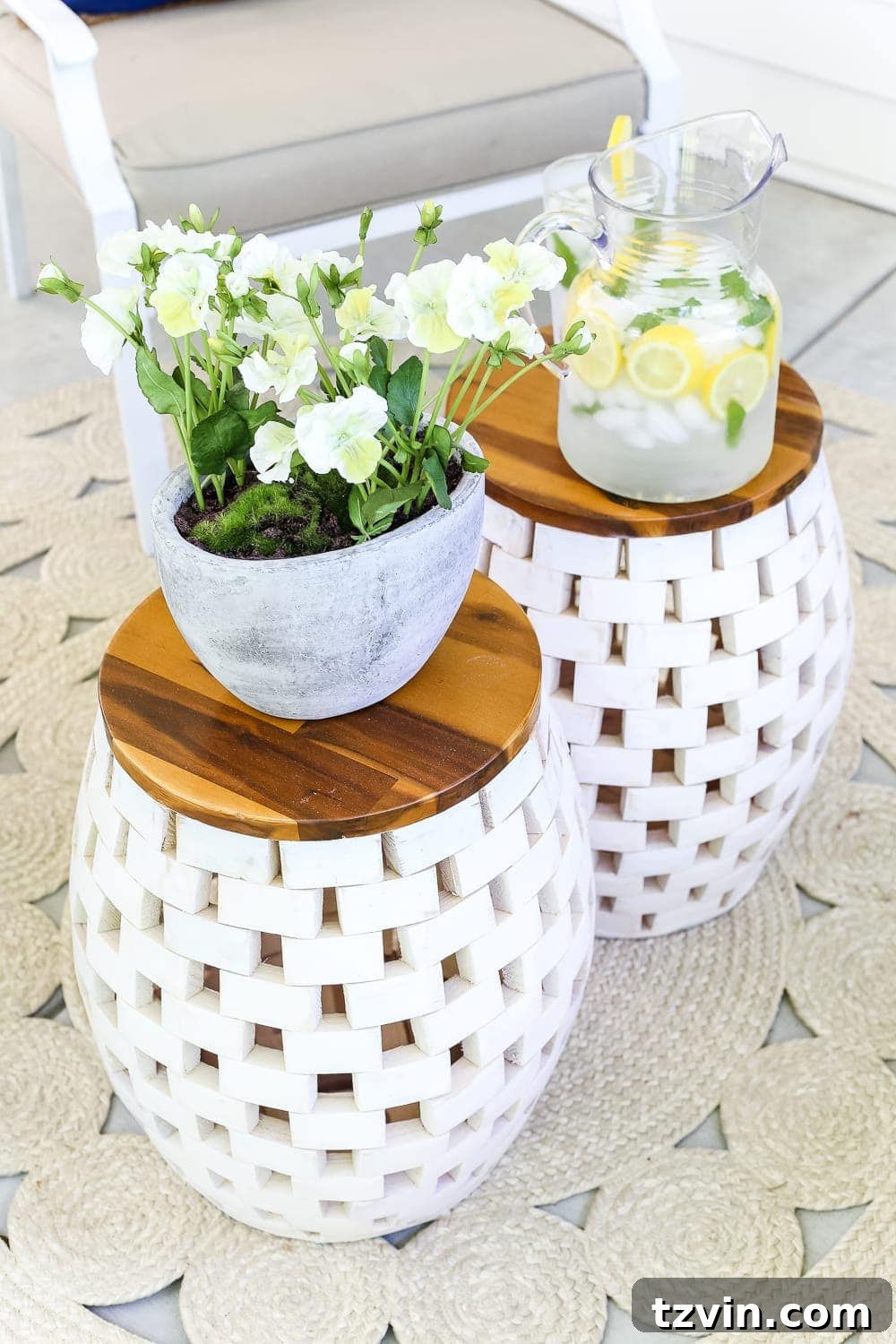 Unlock Your Outdoor Space's Full Potential 4 Close-up of a white garden stool with a textured surface, placed outdoors as a versatile decor piece.