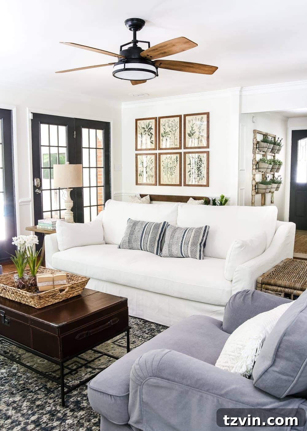 A Modern French Farmhouse Summer Retreat 11 Cozy Modern French Farmhouse Living Room - A summer home tour featuring modern French farmhouse style, inexpensive decorating tricks, and ways to make your home look luxurious on a budget.