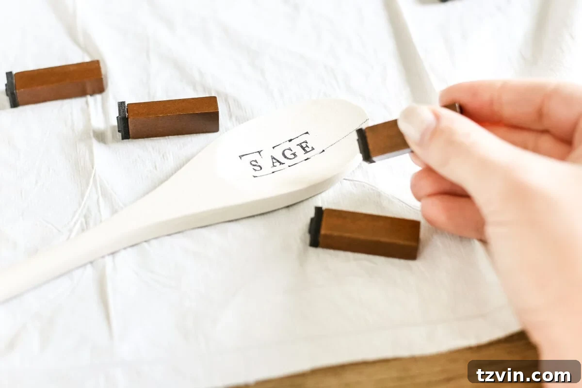 Craft Your Own Wooden Spoon Plant Tags 5 DIY Wooden Spoon Garden Markers | blesserhouse.com - A simple tutorial for how to craft your own vintage-inspired garden markers made from wooden spoons, plus a resource for a beautiful stacked herb garden.