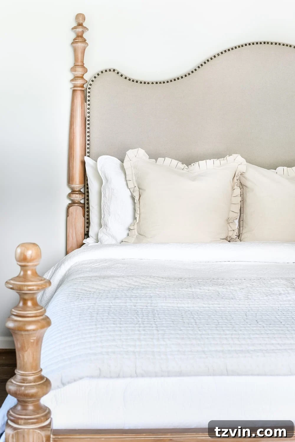 Coastal Charm with Pickled Pine Furniture in the Master Retreat 6 Master Bedroom Update: Pickled Pine Furniture | blesserhouse.com - A close-up of the bed's design, emphasizing the compromise of wood and upholstery.
