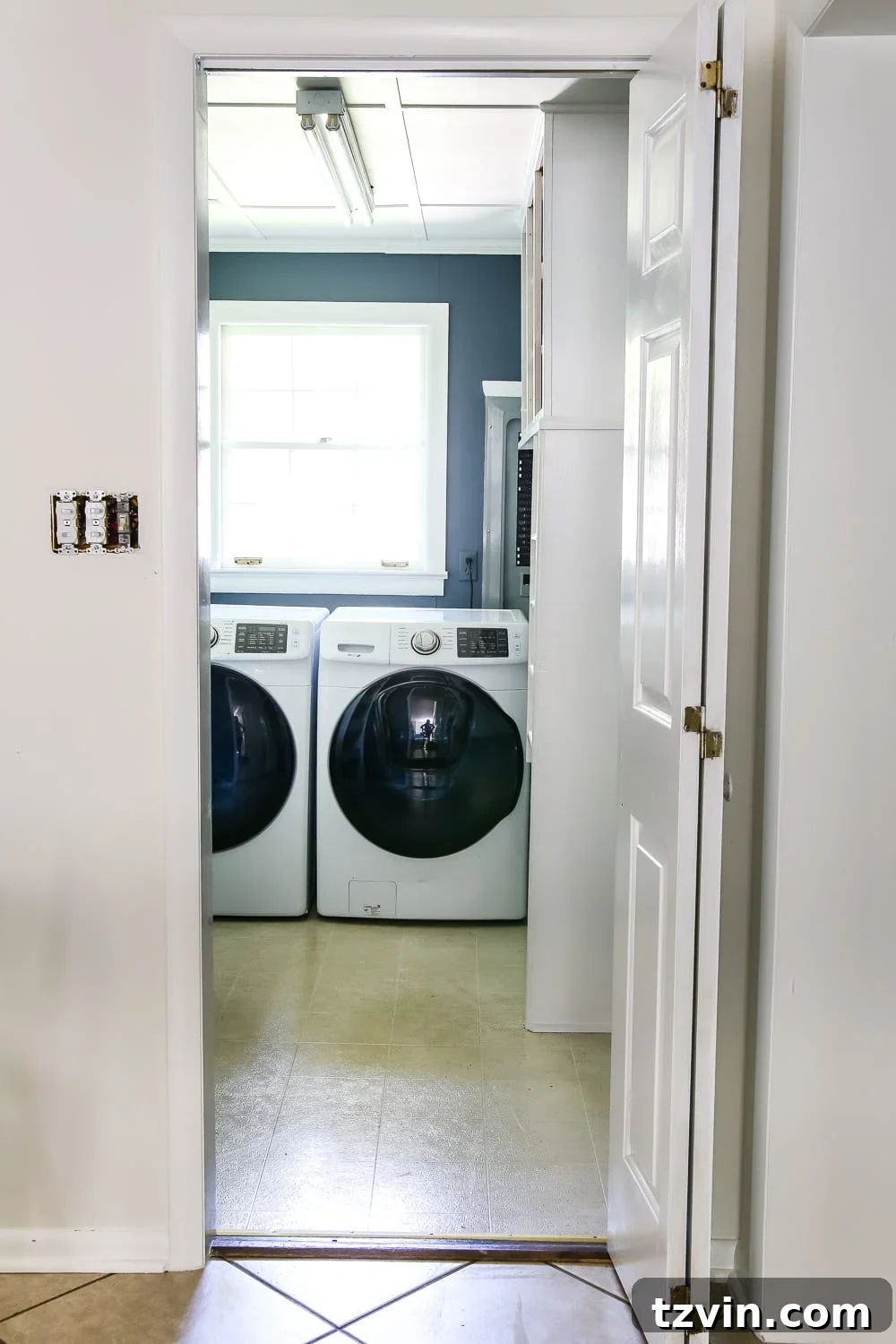 Laundry Room Updates: French Bifold Door | blesserhouse.com - A rickity laundry room bifold door gets a beautiful and functional update with a French bifold door with frosted glass for hiding messes in a stylish way.