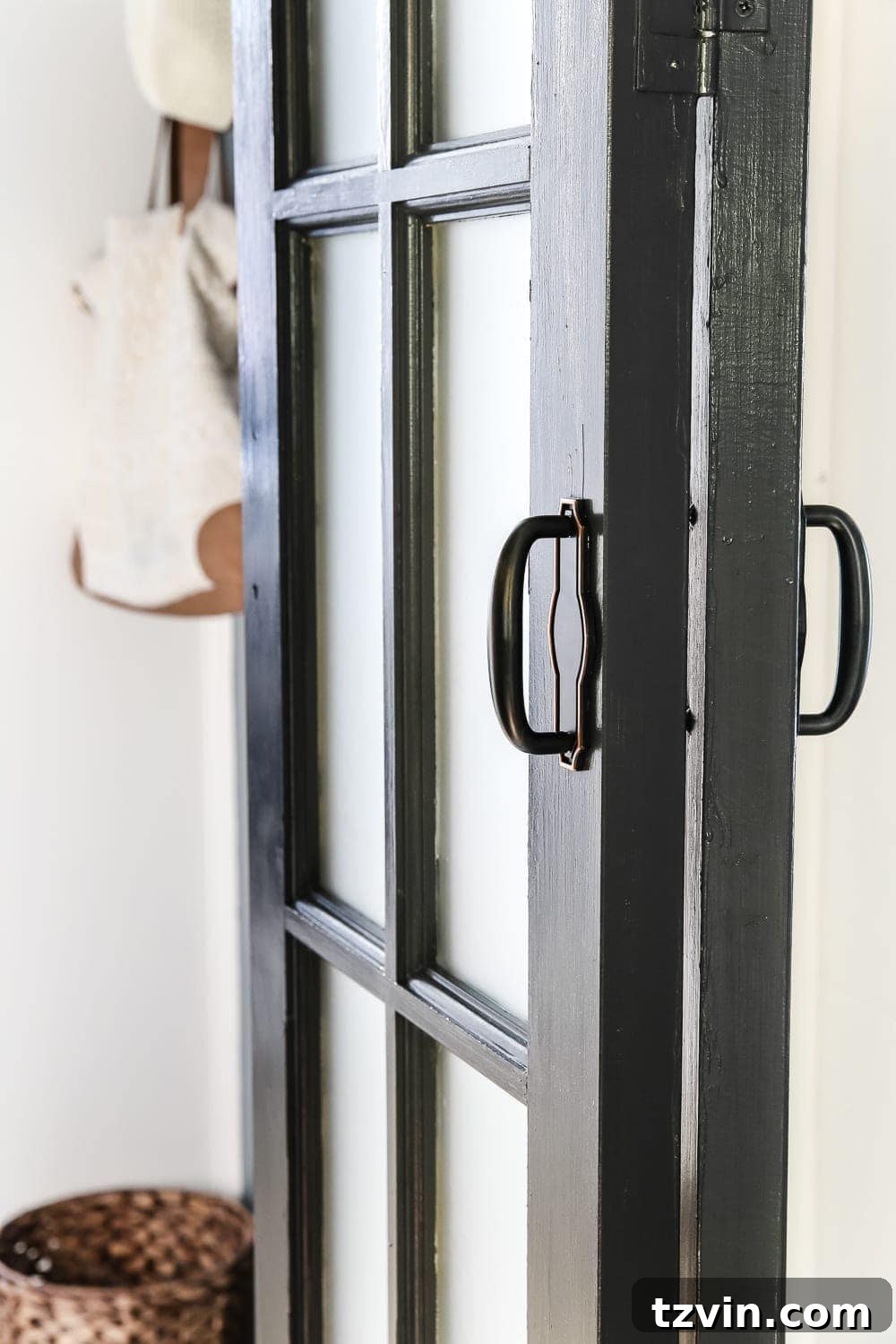 Laundry Room Updates: French Bifold Door | blesserhouse.com - A rickity laundry room bifold door gets a beautiful and functional update with a French bifold door with frosted glass for hiding messes in a stylish way.