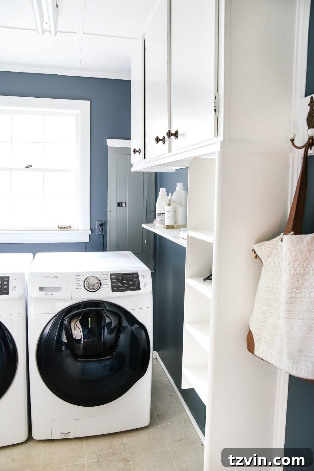 Laundry Room Updates: French Bifold Door | blesserhouse.com - A rickity laundry room bifold door gets a beautiful and functional update with a French bifold door with frosted glass for hiding messes in a stylish way.