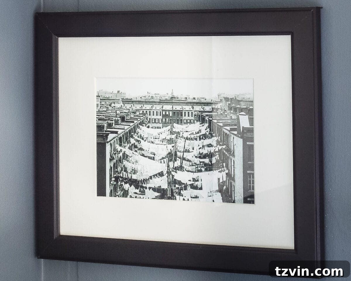 Charming Vintage Laundry Day Art Prints 8 Vintage Clothesline Laundry Room Art Printable Set | blesserhouse.com - A free downloadable printable set of 6 vintage black & white clothesline cityscape and countryscape photos perfect for framing in a laundry room.