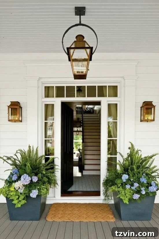 southern living front porch curb appeal with lanterns and potted ferns