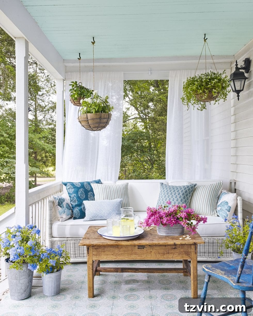 country porch with hanging baskets and blue painted ceiling