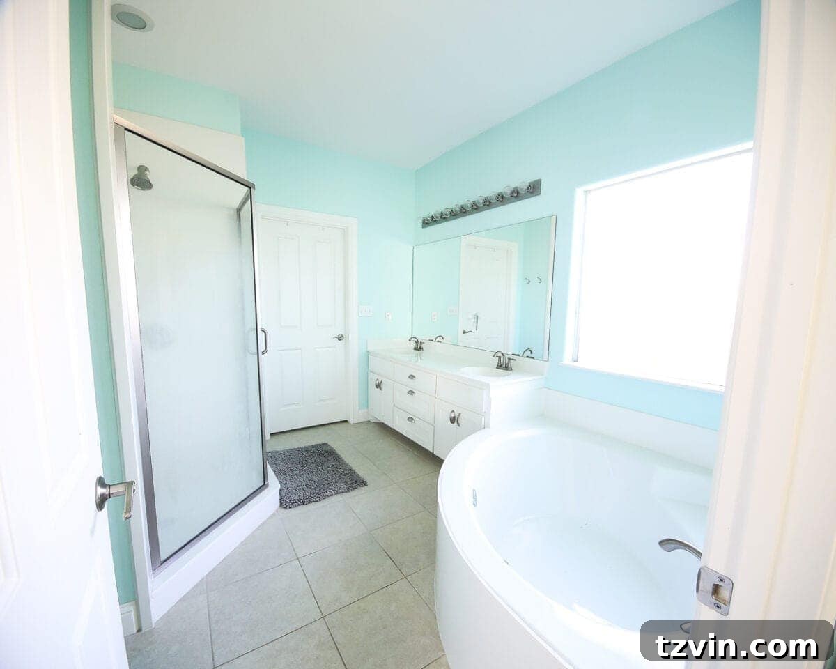 Lowes Bathroom Remodel Showcase 12 Before: A dull, builder-grade bathroom with standard amenities and no distinctive style.