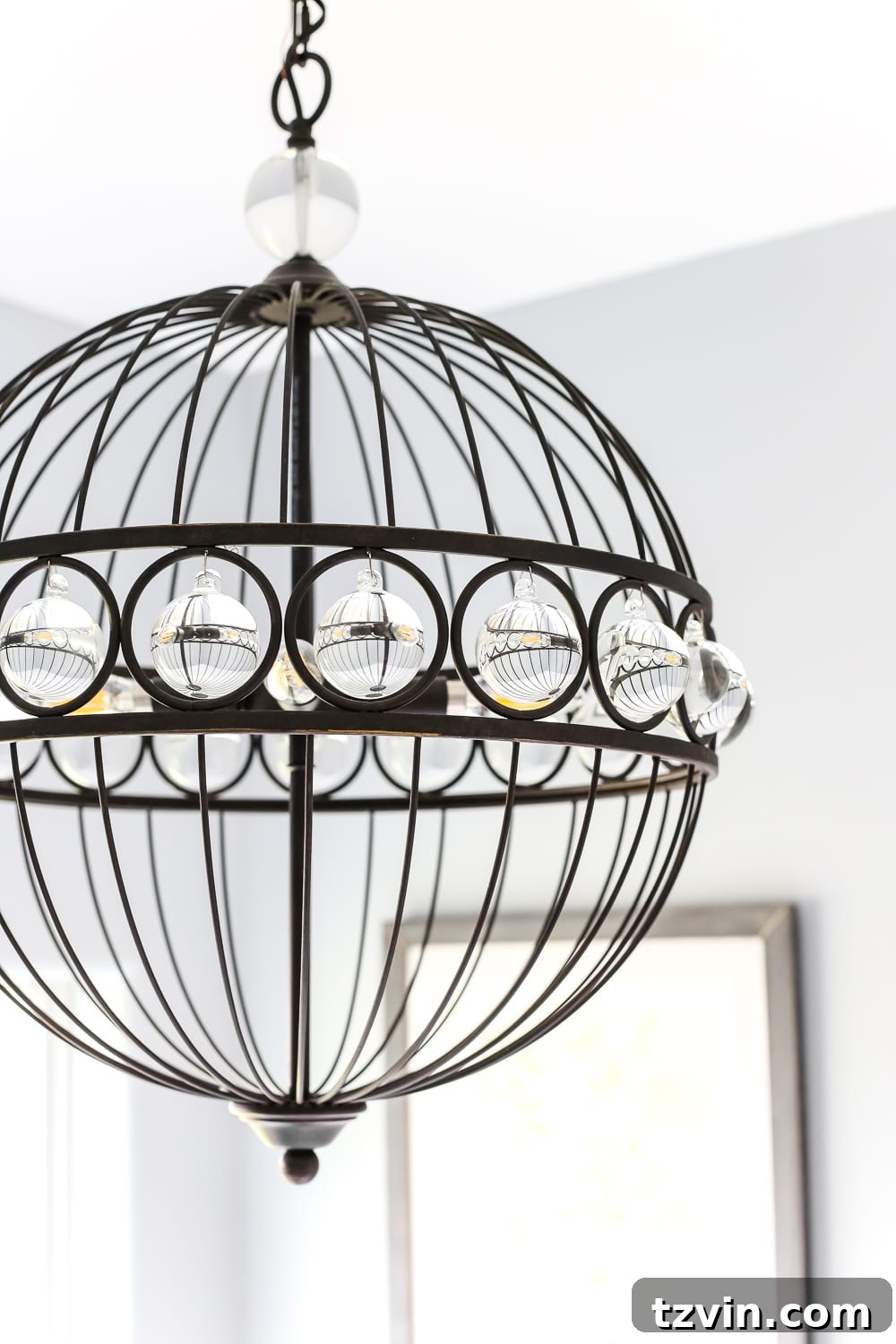 Lowes Bathroom Remodel Showcase 18 A stunning chandelier blends glam and industrial styles, providing elegant lighting above the bathtub.