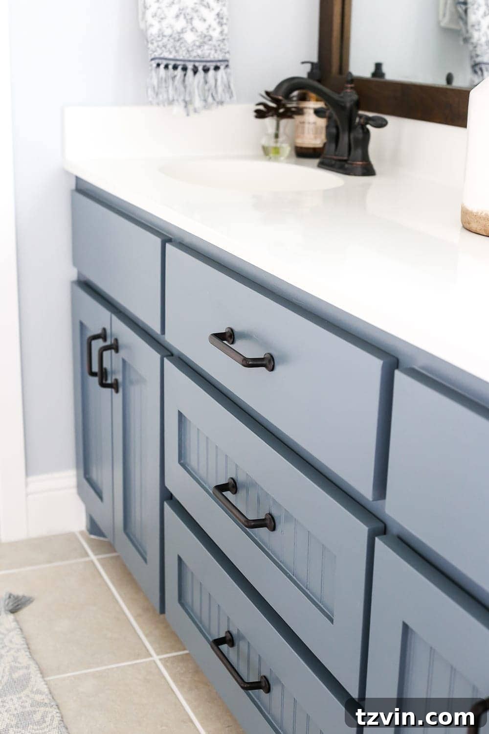 Lowes Bathroom Remodel Showcase 21 The bathroom vanity painted in Sherwin Williams Slate Tile, paired with soft gray walls.