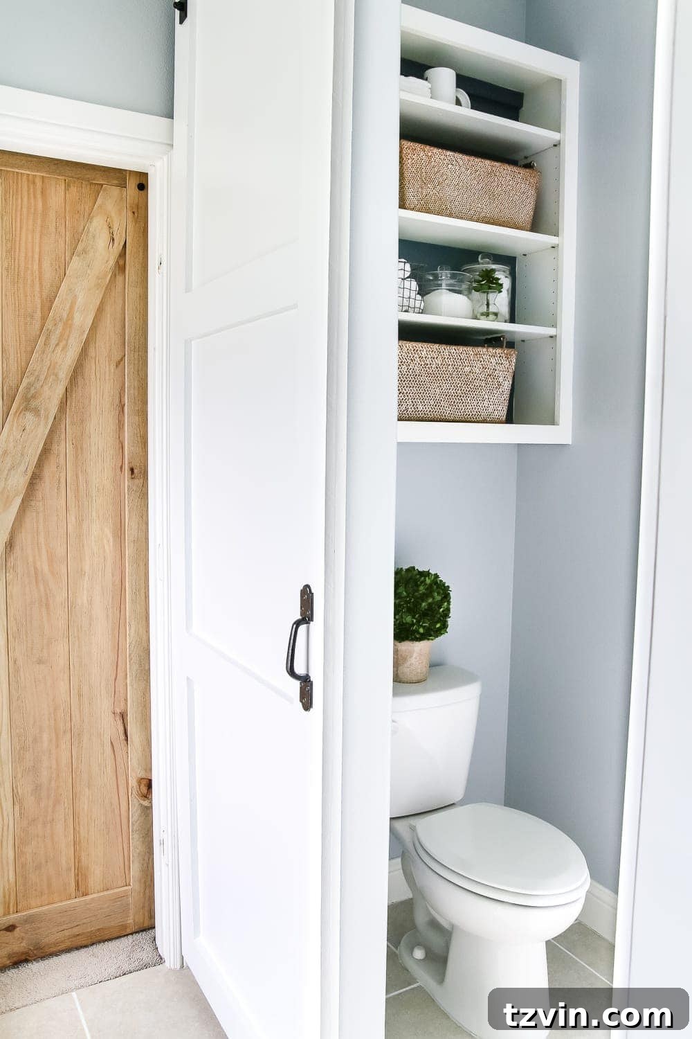 Lowes Bathroom Remodel Showcase 24 A custom-built sliding barn door enhances privacy and adds a rustic aesthetic to the water closet.
