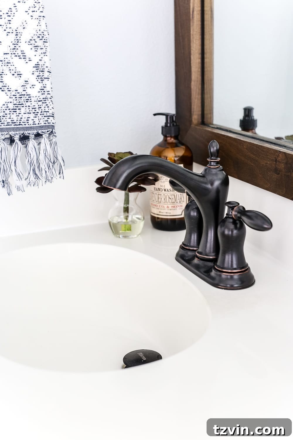 Lowes Bathroom Remodel Showcase 26 New curvier bronze sink faucets add a refined, feminine touch to the vanity area.