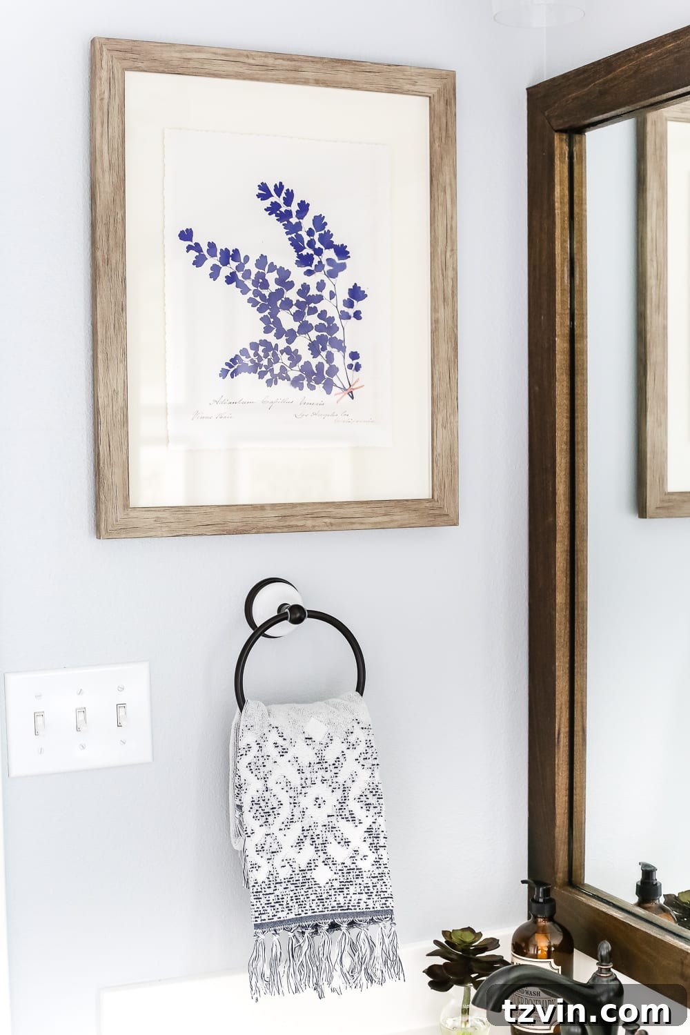 Lowes Bathroom Remodel Showcase 28 A blue botanical print positioned beside the vanity, adding a modern farmhouse artistic touch.