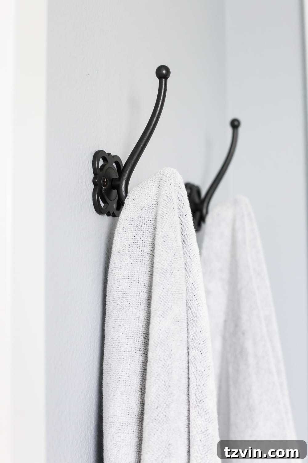 Lowes Bathroom Remodel Showcase 29 Practical wall hooks installed near the shower door offer convenient storage for towels.