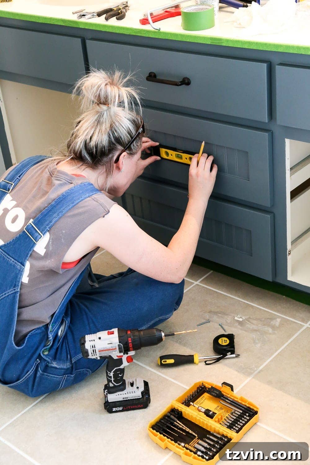 Lowes Bathroom Remodel Showcase 8 Jenna works on installing new hardware and fixtures, demonstrating meticulous attention to detail.