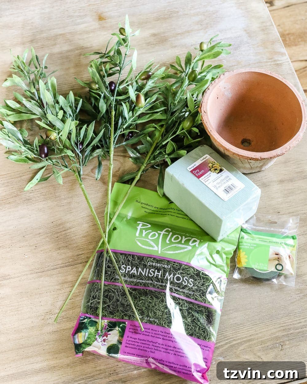 Craft Your Own Olive Topiary 3 DIY Olive Topiary Trees | blesserhouse.com - A 10 minute craft tutorial for how to make an olive topiary tree (or any kind of topiary) inexpensively + 11 DIY summer decor ideas.