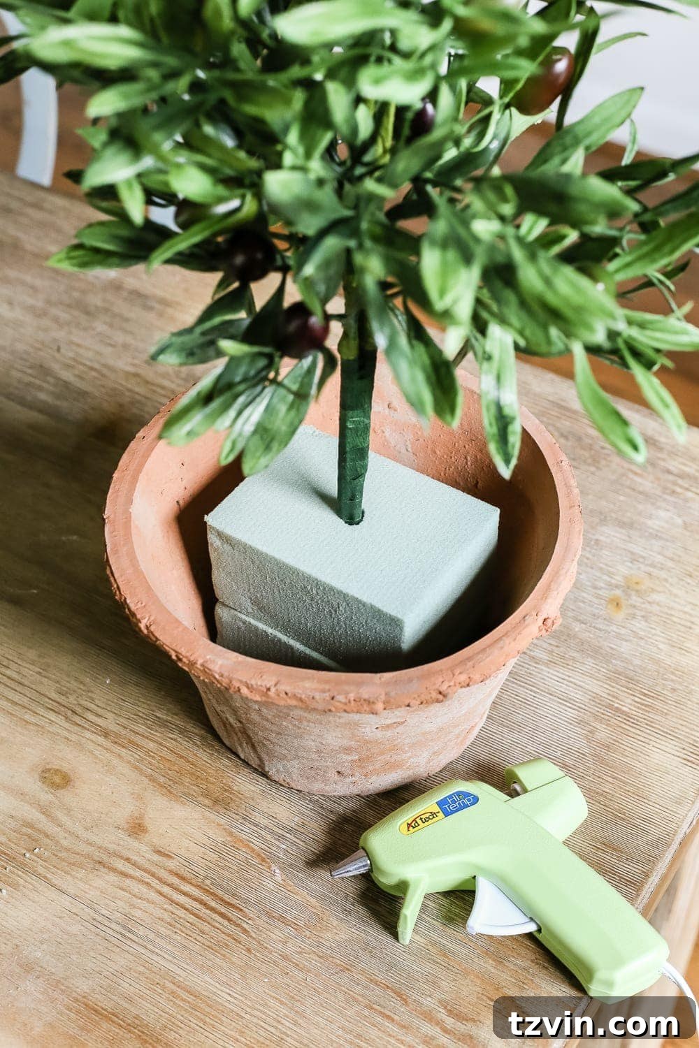 Craft Your Own Olive Topiary 7 DIY Olive Topiary Trees | blesserhouse.com - A 10 minute craft tutorial for how to make an olive topiary tree (or any kind of topiary) inexpensively + 11 DIY summer decor ideas.