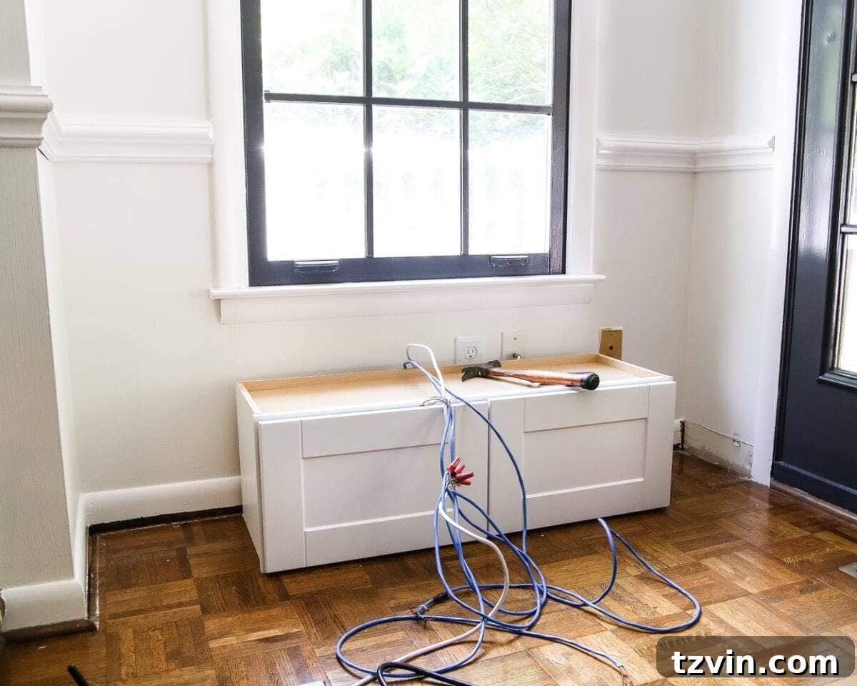 Kitchen Cabinet Window Seat Transformation 3 DIY Window Seat from a Kitchen Cabinet | blesserhouse.com - A simplified tutorial for how to build a DIY window seat using a prefabbed kitchen cabinet to house electronics and hide cords.
