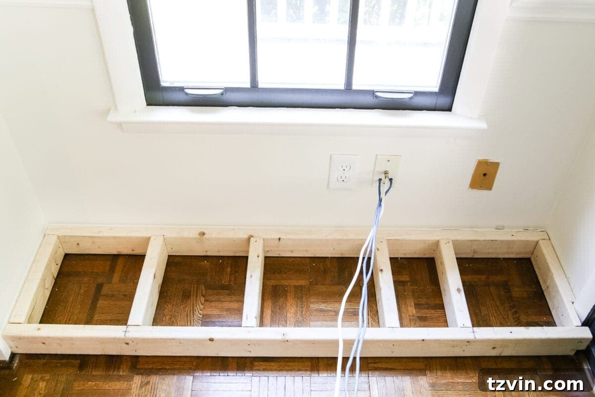 Kitchen Cabinet Window Seat Transformation 4 DIY Window Seat from a Kitchen Cabinet | blesserhouse.com - A simplified tutorial for how to build a DIY window seat using a prefabbed kitchen cabinet to house electronics and hide cords.