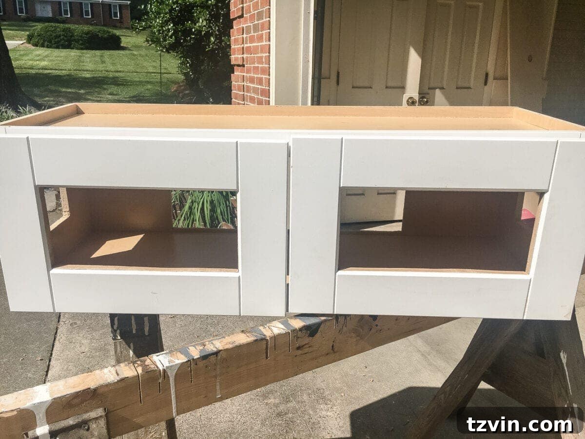 Kitchen Cabinet Window Seat Transformation 8 DIY Window Seat from a Kitchen Cabinet | blesserhouse.com - A simplified tutorial for how to build a DIY window seat using a prefabbed kitchen cabinet to house electronics and hide cords.