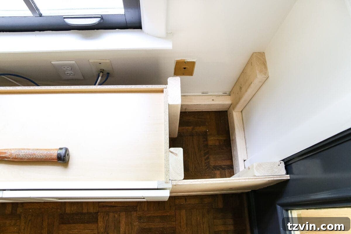 Kitchen Cabinet Window Seat Transformation 9 DIY Window Seat from a Kitchen Cabinet | blesserhouse.com - A simplified tutorial for how to build a DIY window seat using a prefabbed kitchen cabinet to house electronics and hide cords.